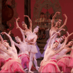 A group of ballet dancers in pink tutus.